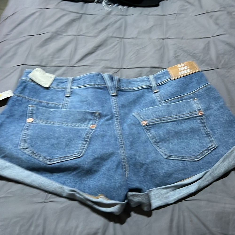 NWT we the free denim shorts. Never worn. Pet friendly home. - Picture 2 of 3